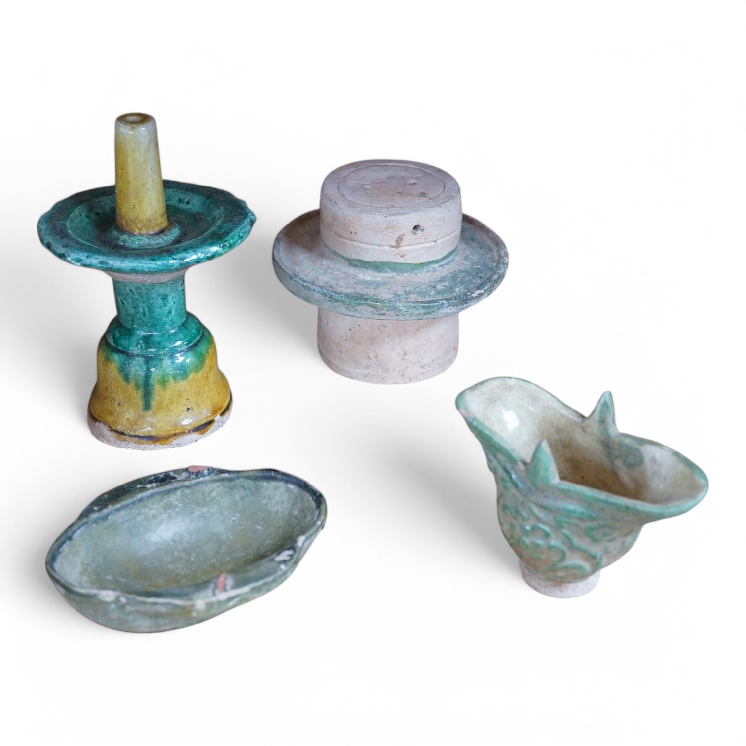 Four Tang dynasty and later pottery items, to include an ear cup, largest 15cm high. Condition - fair